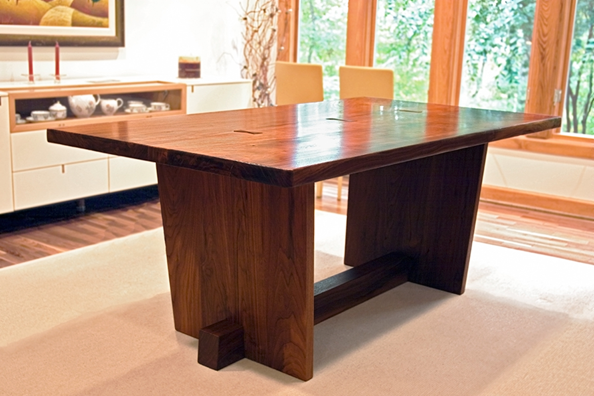 Custom trestle dining table, shown in walnut